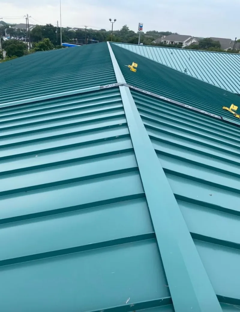 Green commercial metal roof ridge and valley for Metal Roof Repair in Hopkinton